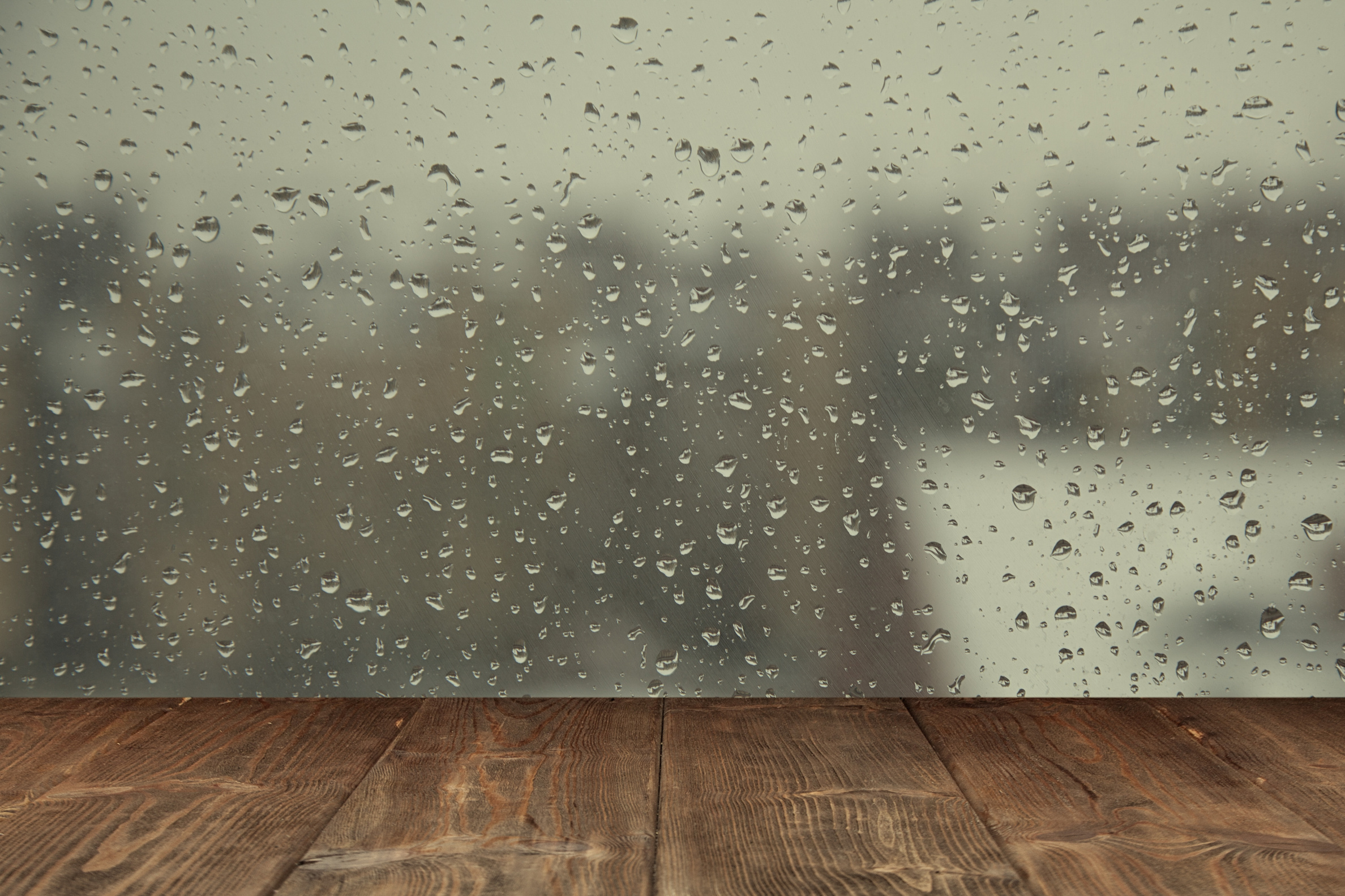Table on Rainy Window Background